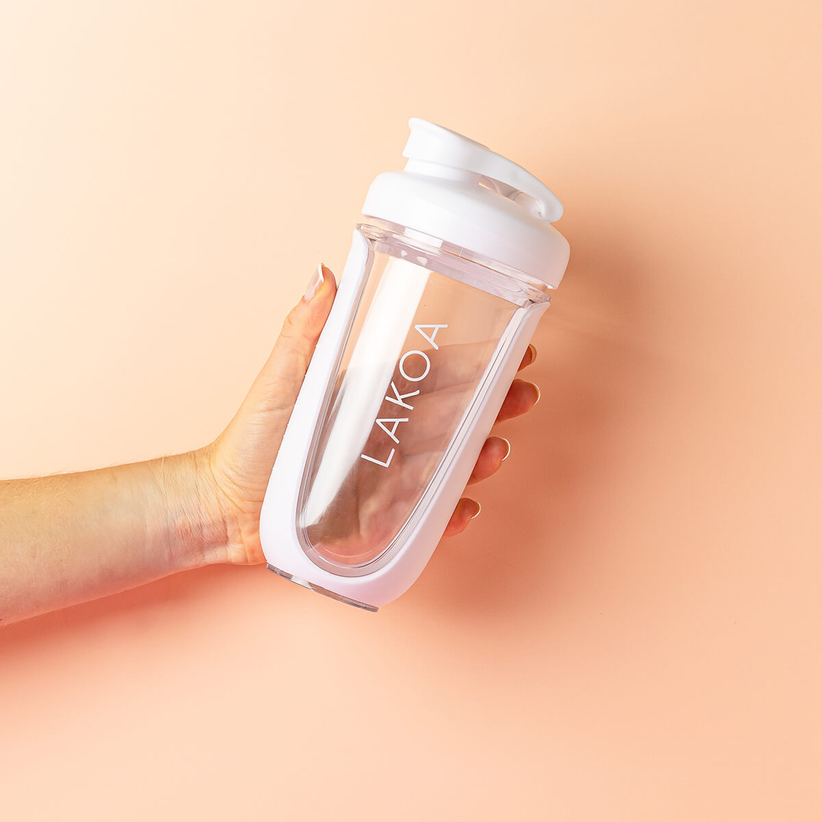 Hand holding supplement shaker